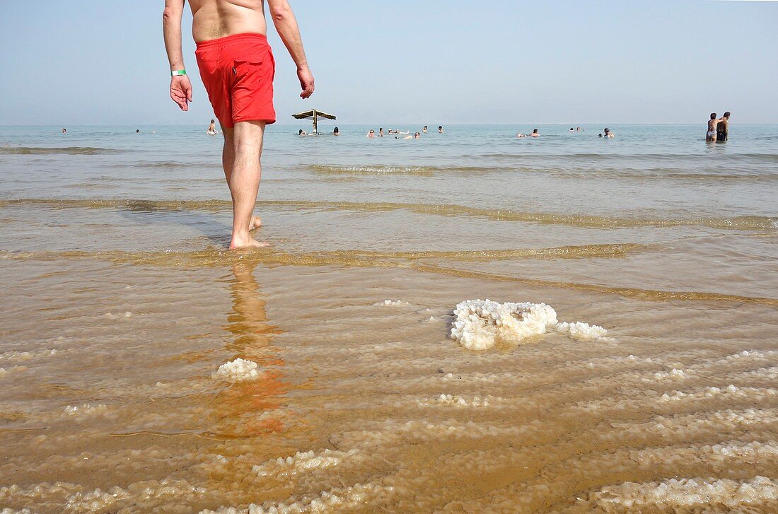Bathers and salt, Dead Sea, Israel
