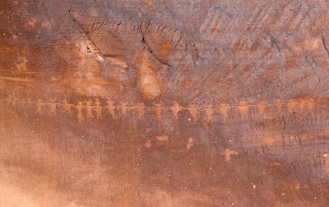 Petroglyphs of figures holding hands