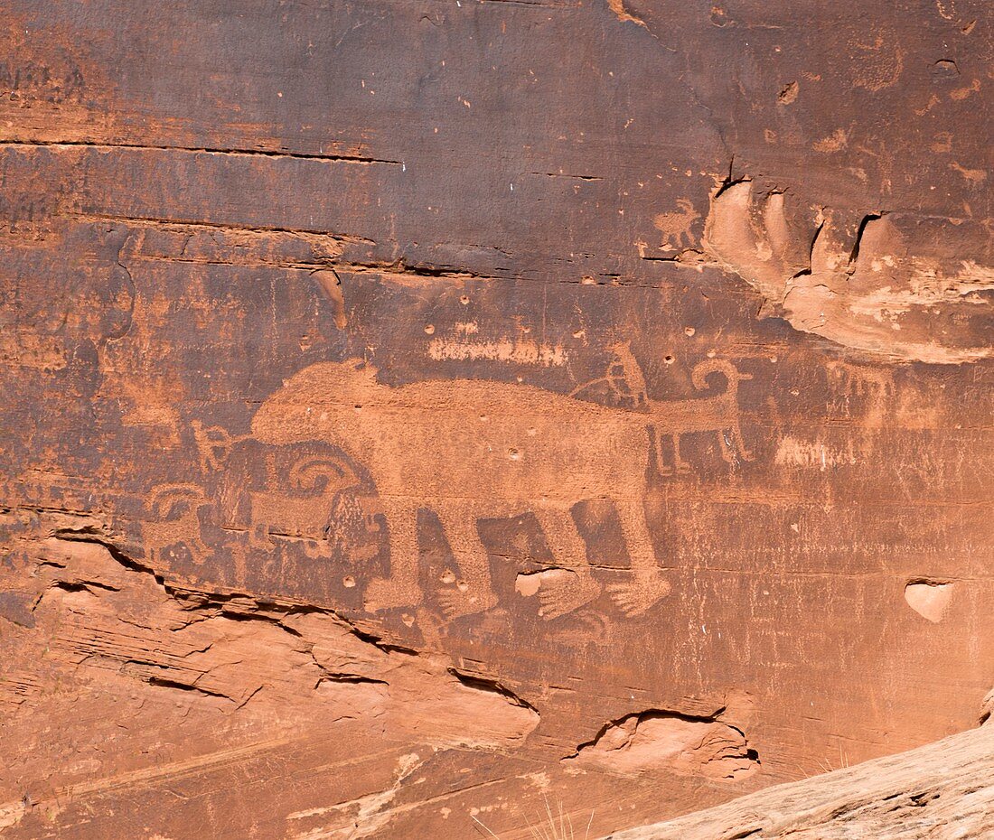 Ancient petroglyph of a bear hunt