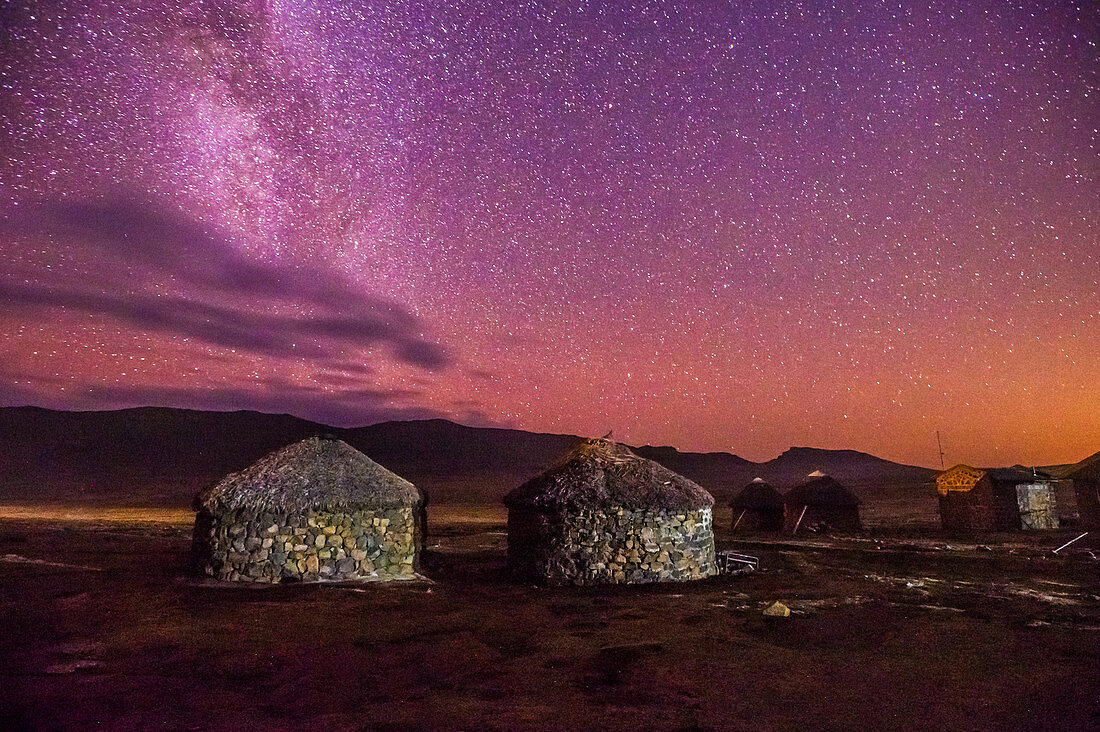 Stone and Thatch huts under Milky way, Sani Pass, Lesotho