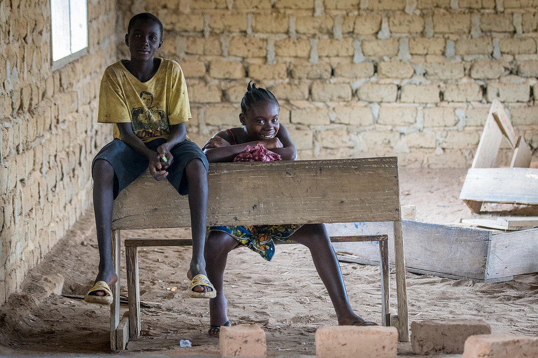 A girl and boy in classroom, Ganta, Liberia