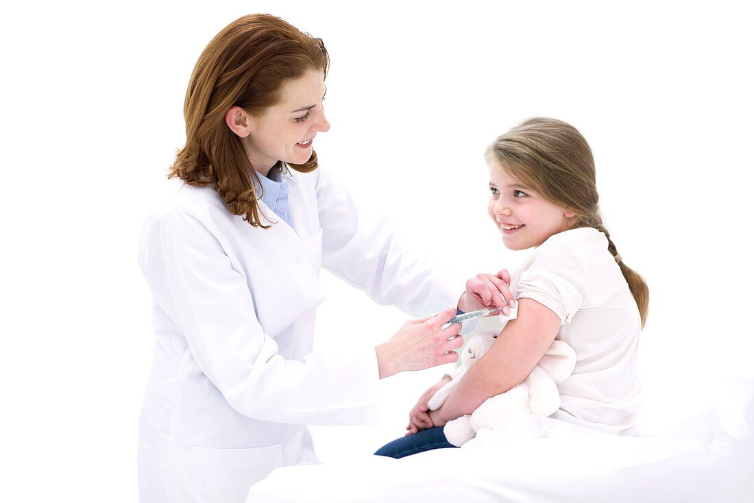 Doctor injecting girl in arm