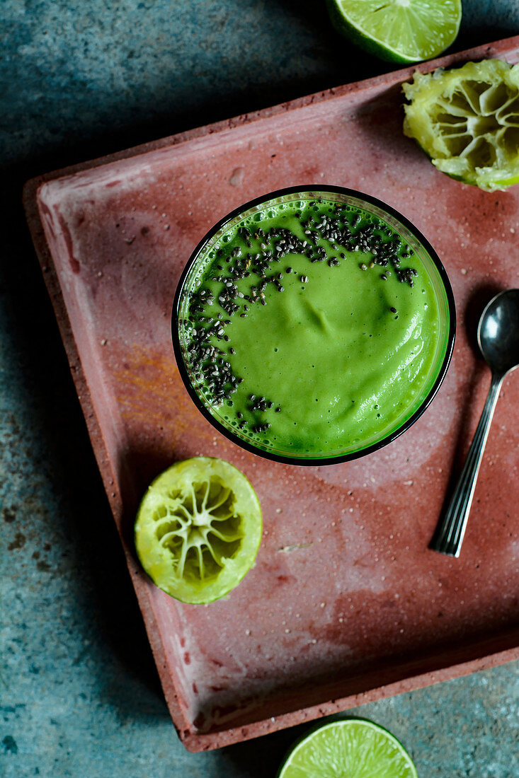 Avocado smoothie with apple juice, lime juice and spinach