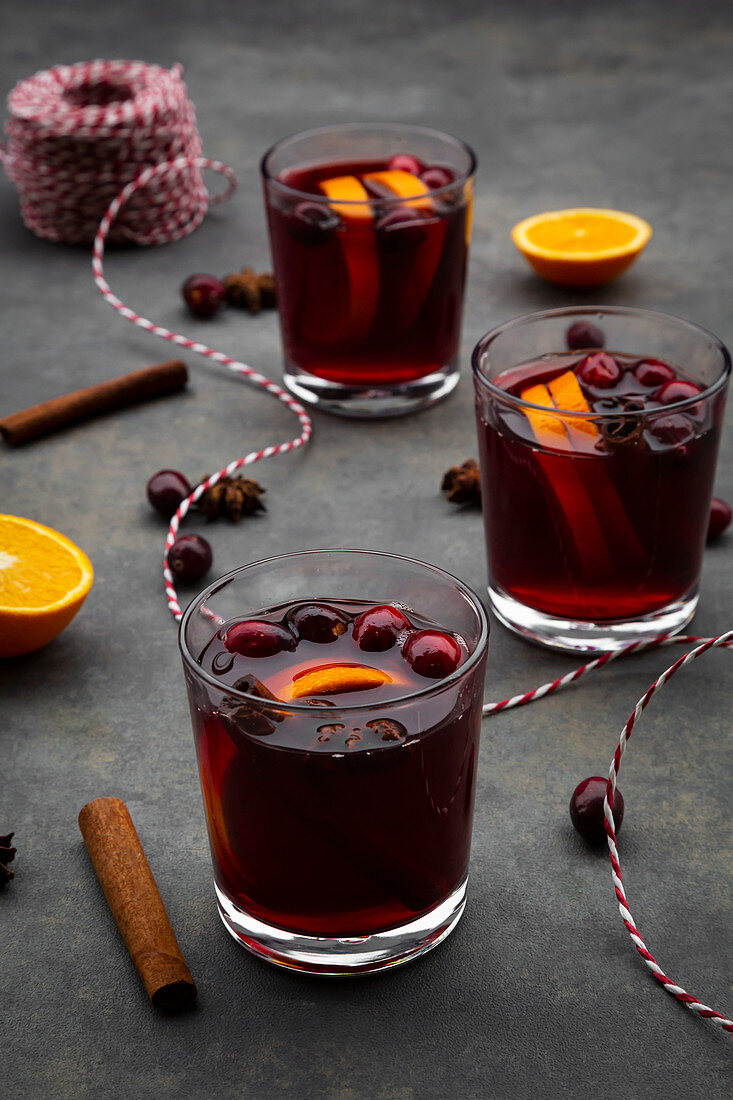 Mulled wine with cranberries, cinnamon, orange slices and star anise