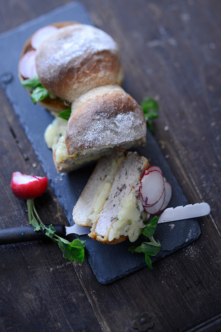 A sandwich with spleen sausage and radishes