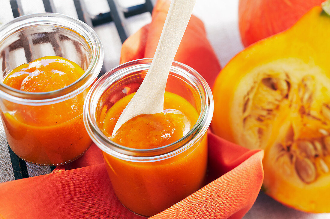 Homemade sweet pumpkin ketchup for barbecuing in jars