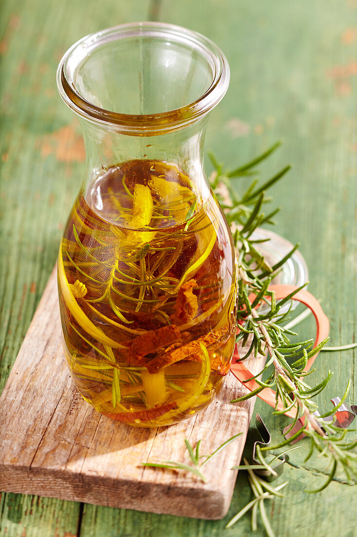 Homemade rosemary oil with dried tomatoes