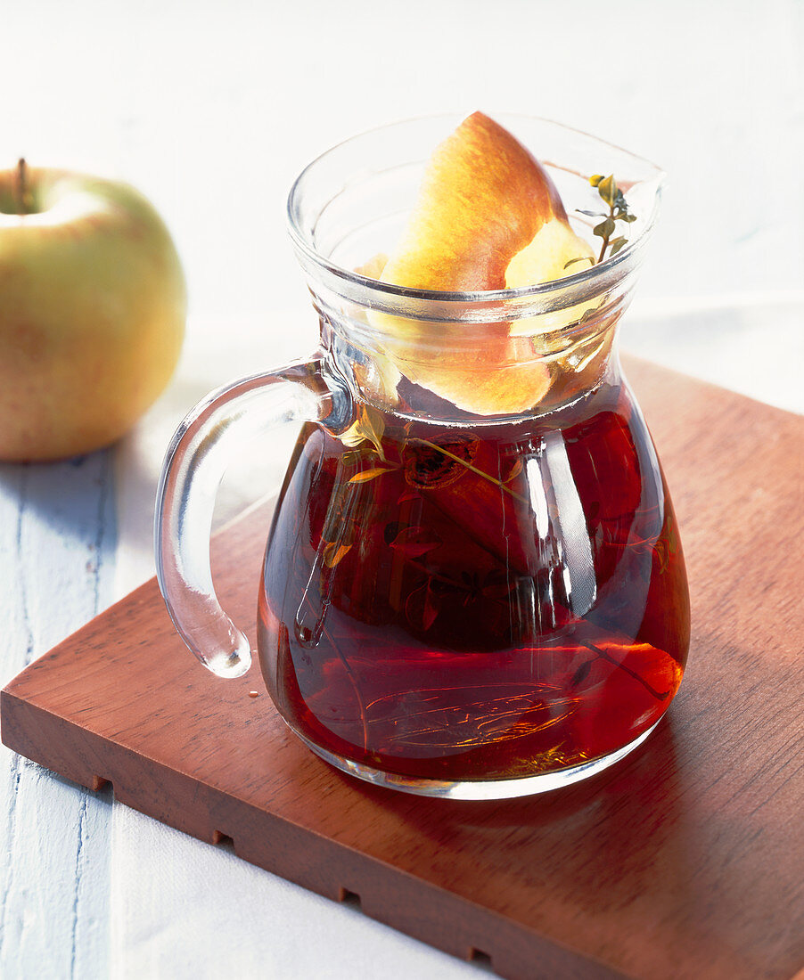 Homemade cider vinegar with cinnamon, agave syrup and thyme