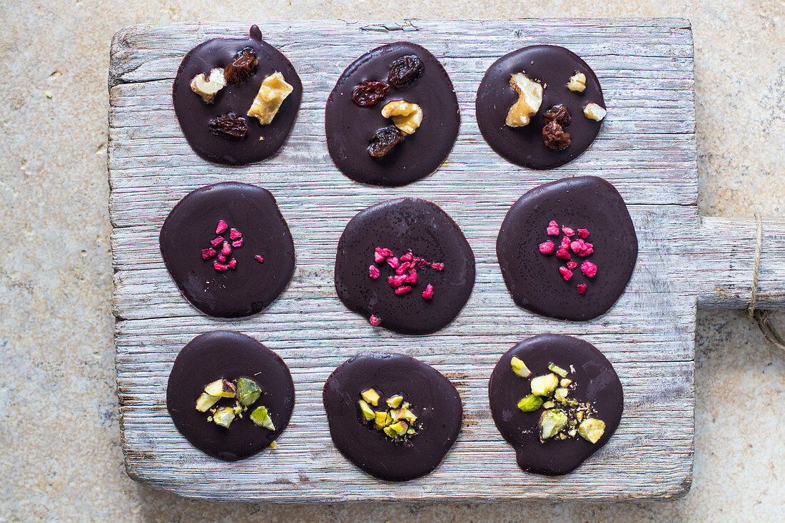 Chocolate disks on a wooden board