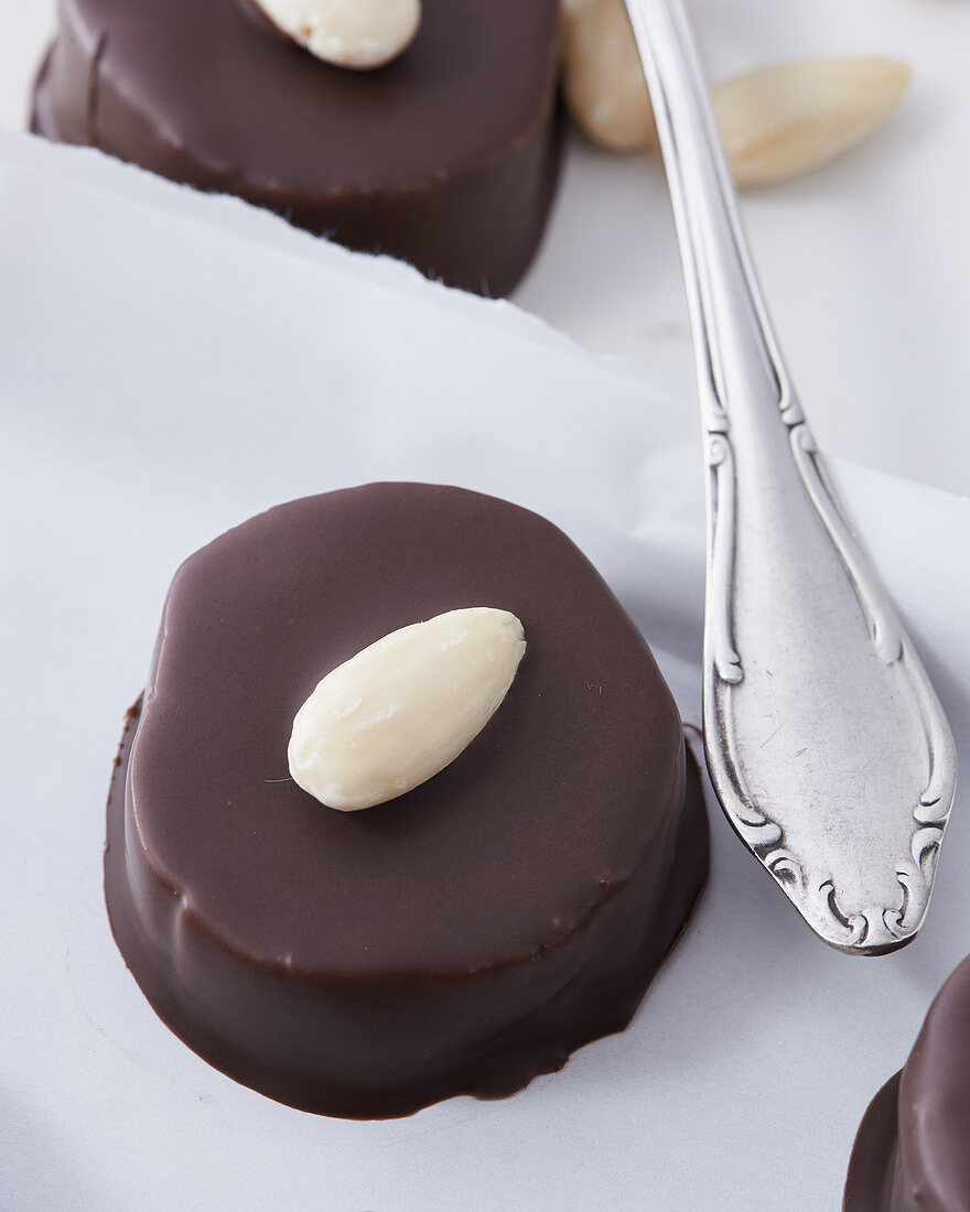 A marzipan nougat biscuit with chocolate glaze, close-up