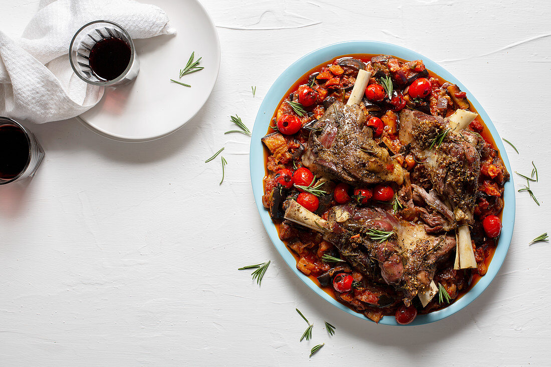 Slow roasted lamb shanks with aubergine and tomato stew
