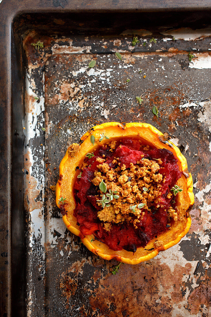 A pumpkin filled with beetroot, cashew and vegan cheese