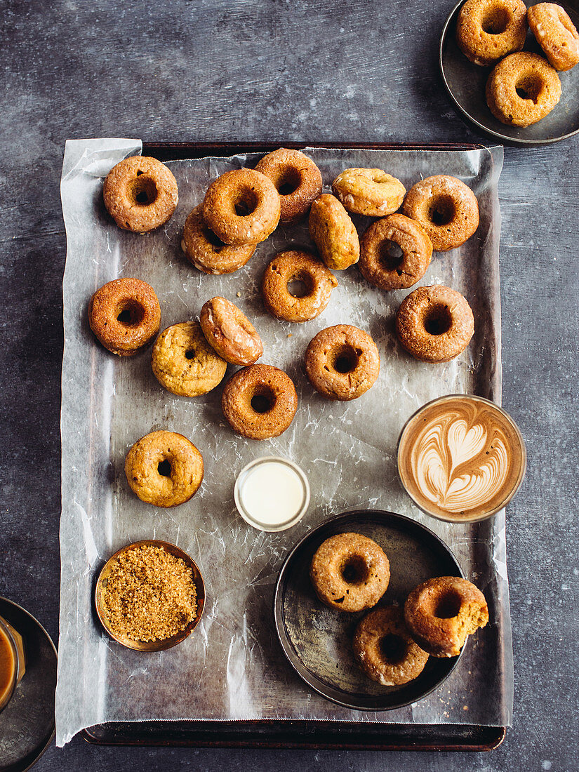 Pumpkin donuts on a baking sheet