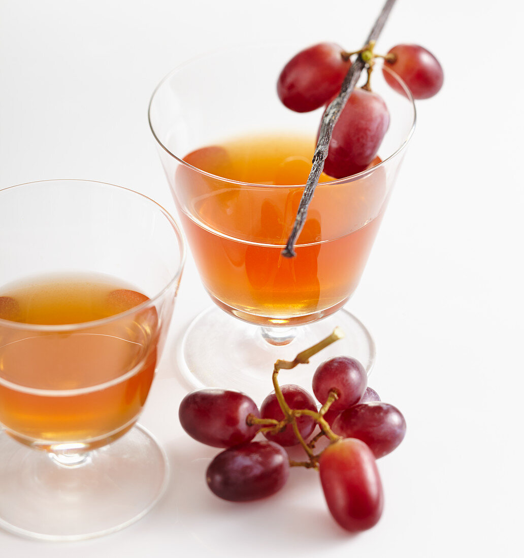 Glasses of homemade grape and vanilla liqueur