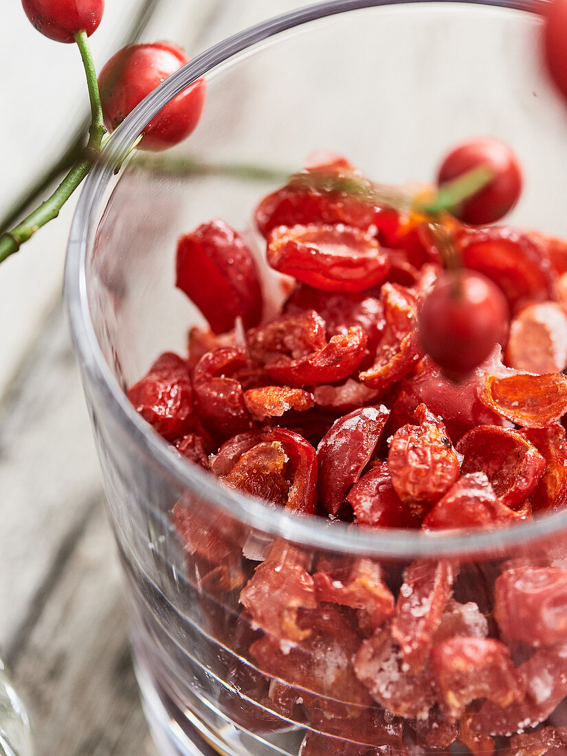 Candied rosehips in a glass