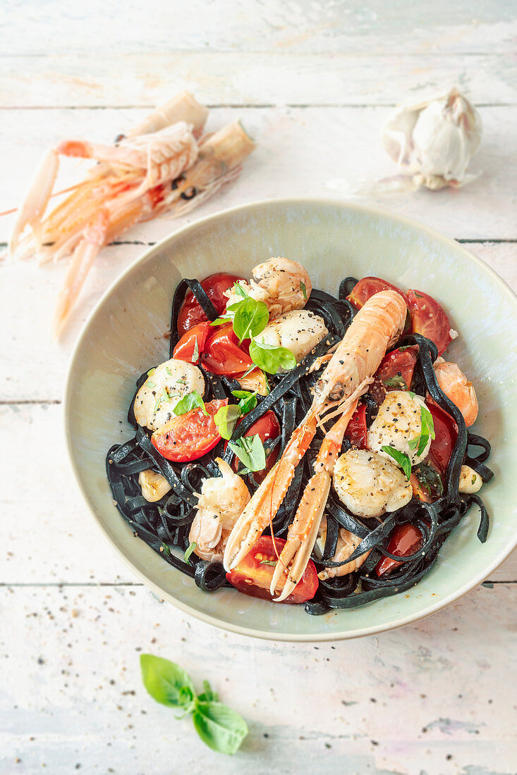 Black pasta with langoustines and scallops