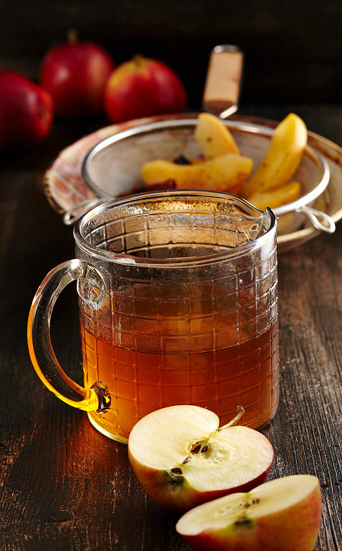 Homemade baked apple liqueur with vanilla, anise, cinnamon and corn schnapps