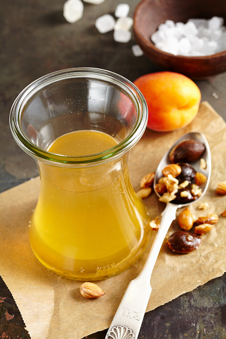 Homemade apricot liqueur with rock sugar and corn schnapps