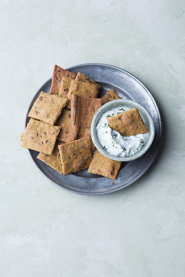 Homemade crackers with herb quark