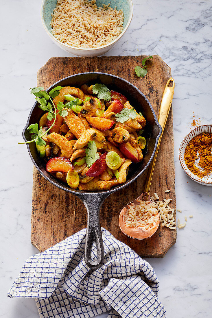 Chicken and coconut curry with plums and leeks