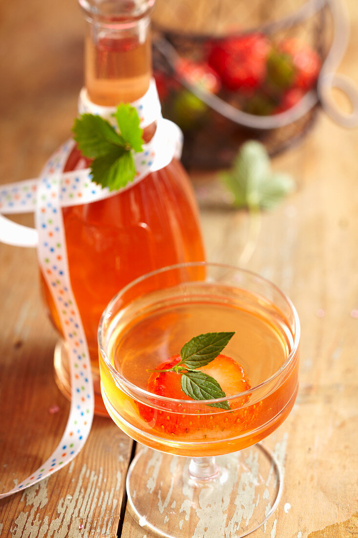 Homemade strawberry and rhubarb liqueur with white wine and vodka