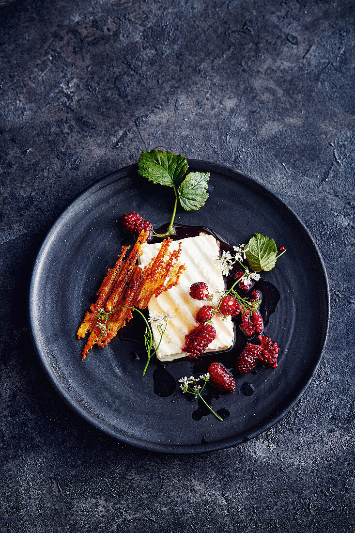 Grilled feta cheese with boysen berries and coriander flowers