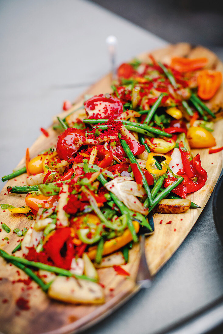 Colourful stir-fried vegetables with beetroot couscous