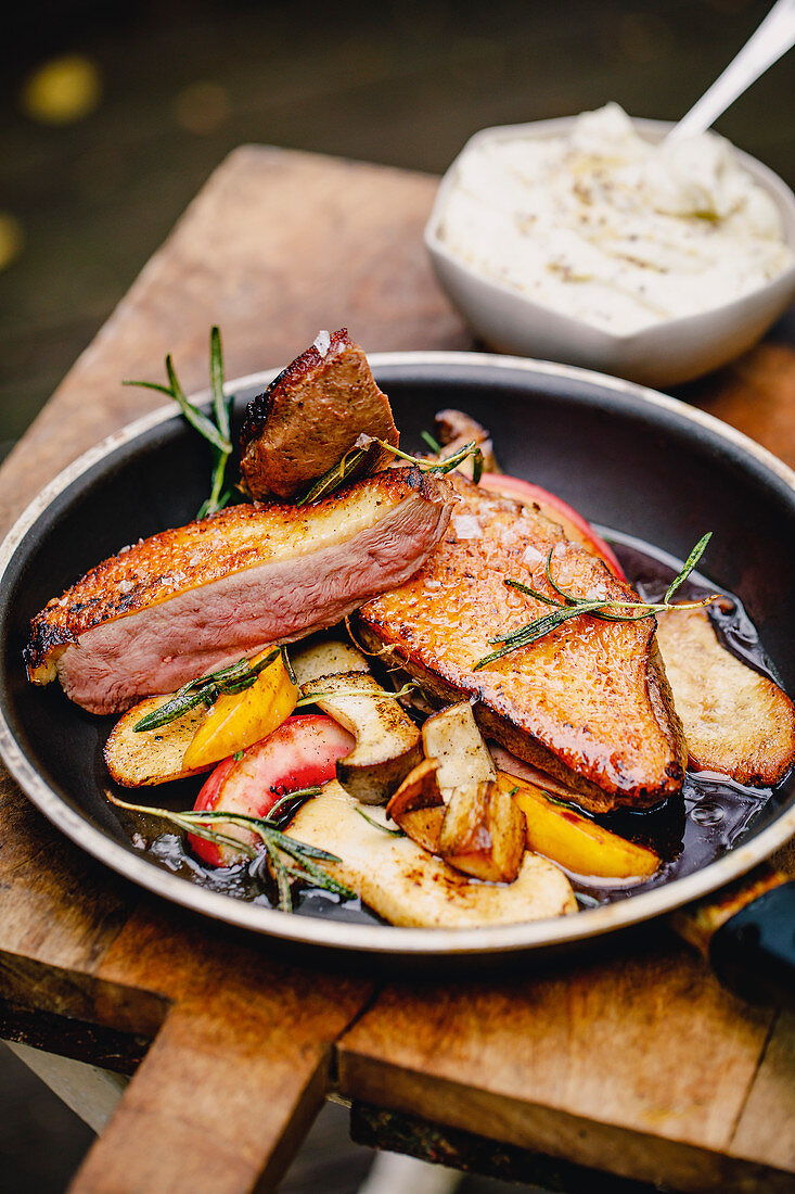 Duck breast fillet with peaches, king trumpet mushrooms and rosemary