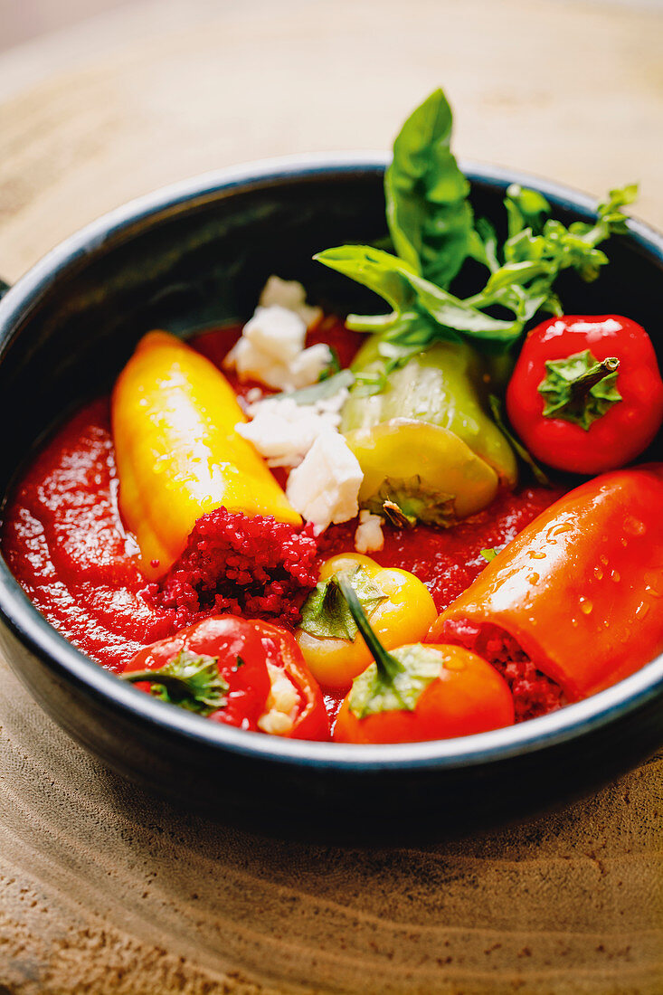 Stuffed peppers with beetroot couscous and tomato sugo