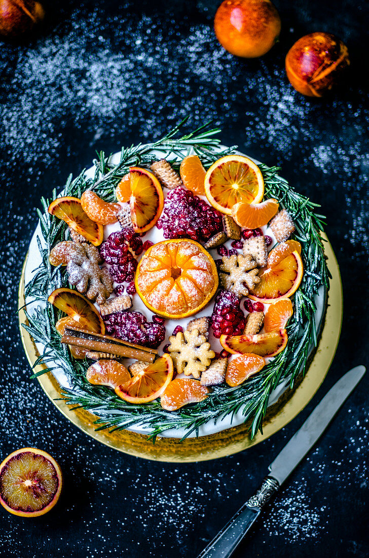 Christmas plate with fruits and cookies