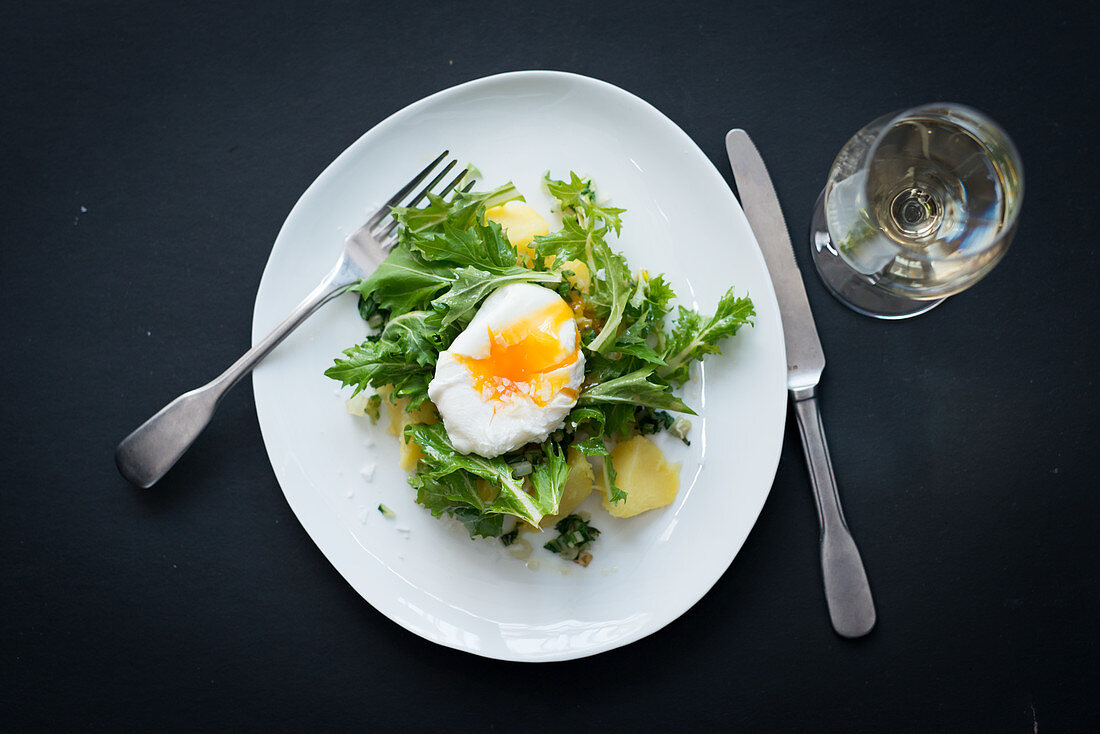 Rapini with a poached egg and potatoes