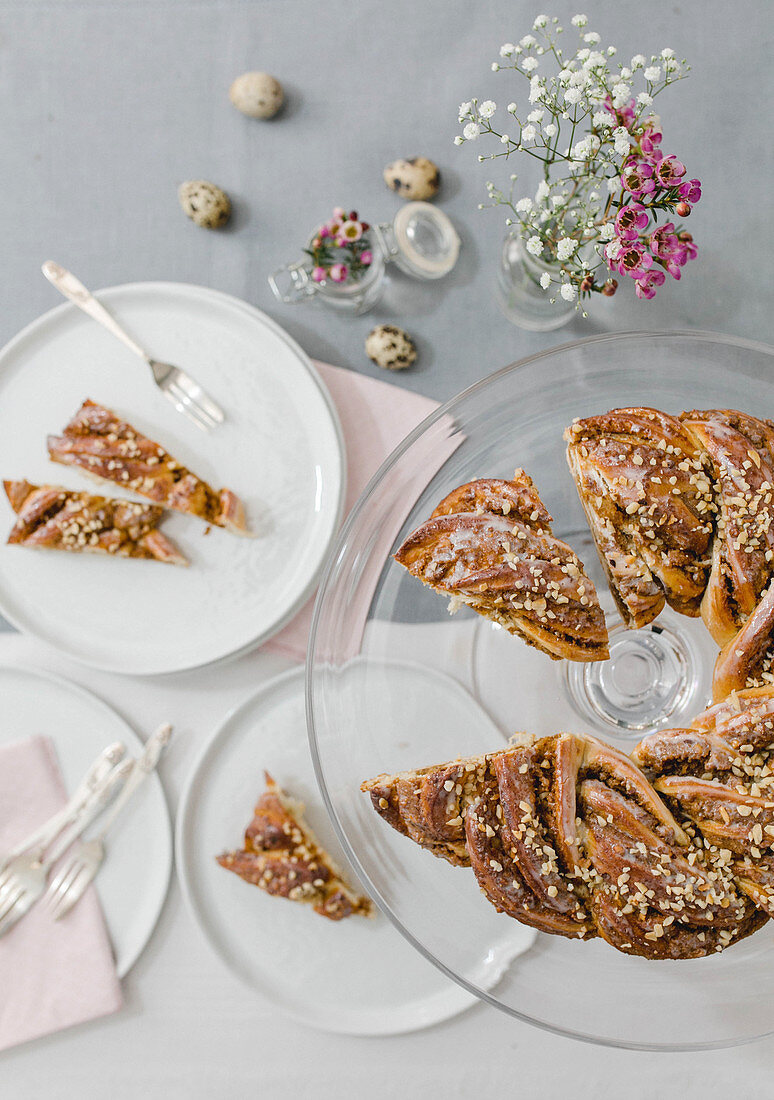 A sliced yeast dough wreath on an Easter table