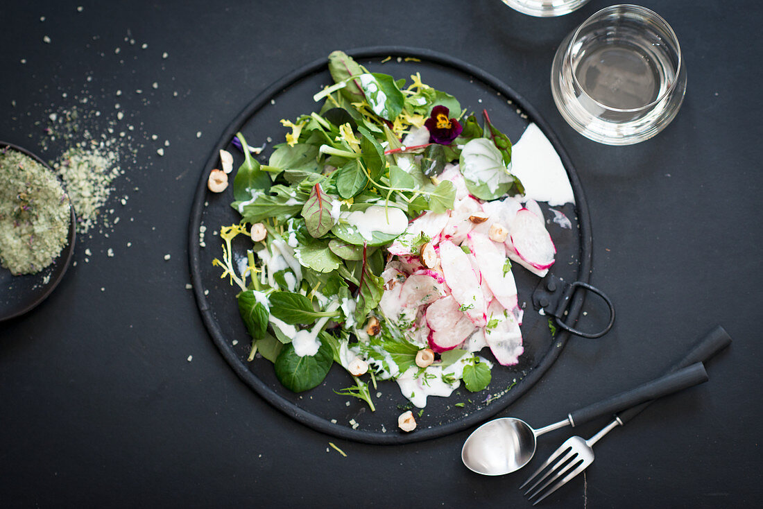 Wild herb salad with radishes and yoghurt dressing