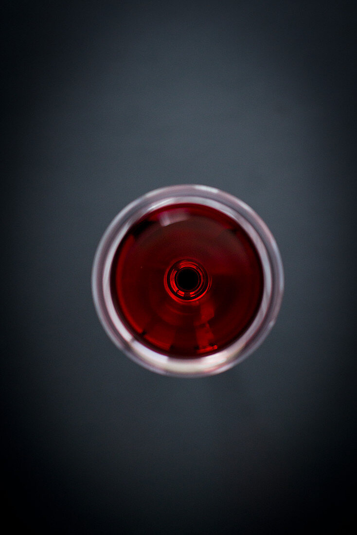 A glass of red wine from above