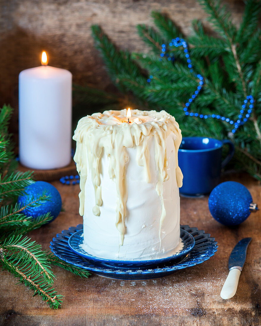 Cake with sour cream and white chocolate resembling candle