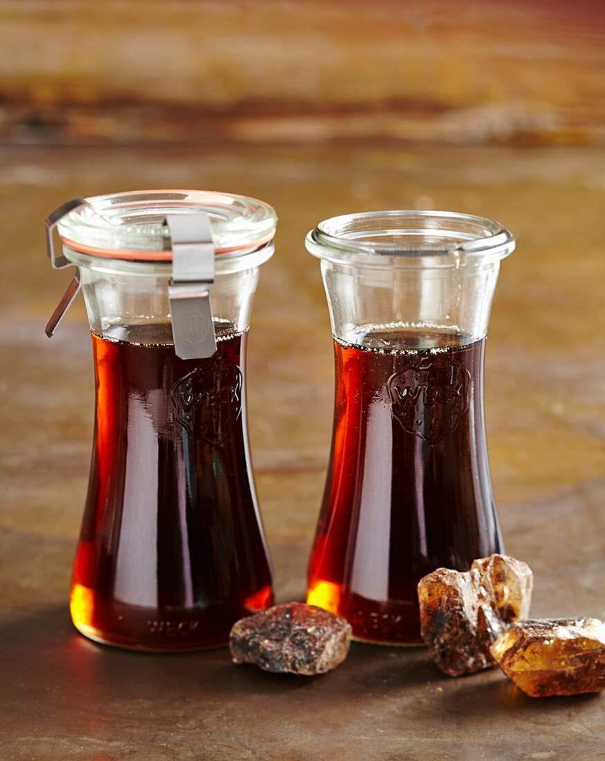 Homemade brown rock sugar syrup in preserving jars
