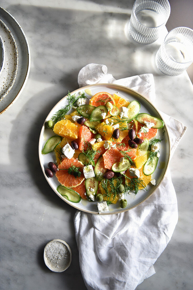 Citrus and cucumber salad with feta cheese and olives