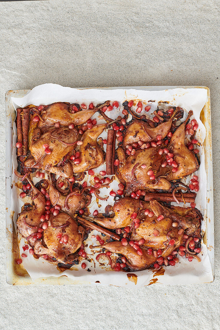 Roasted poussin with pomegranate seeds and cinnamon