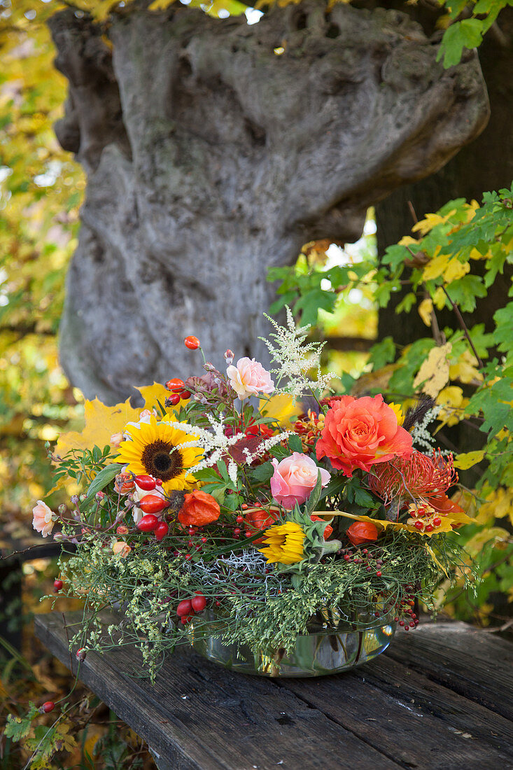 Autumn bouquet in glass bowl