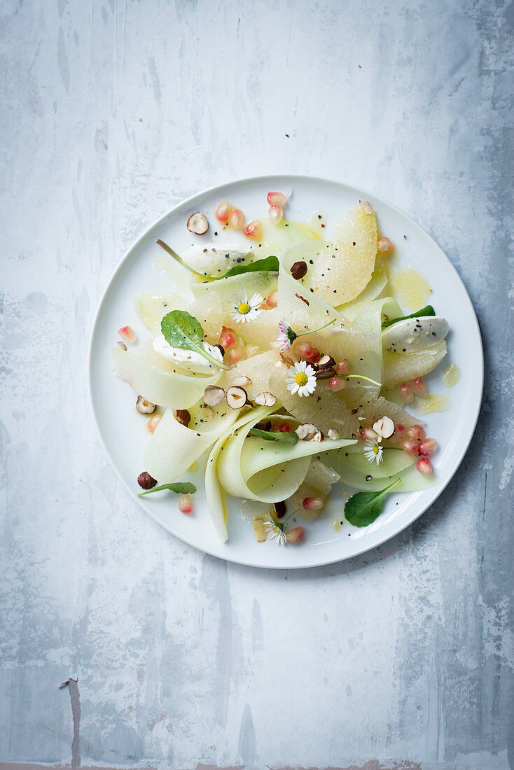 Pomelo and melon salad with pomegranate seeds