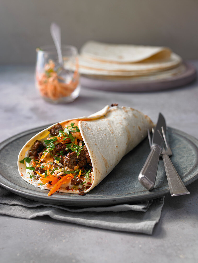 Wraps with farmer salad and spicy beef tatar