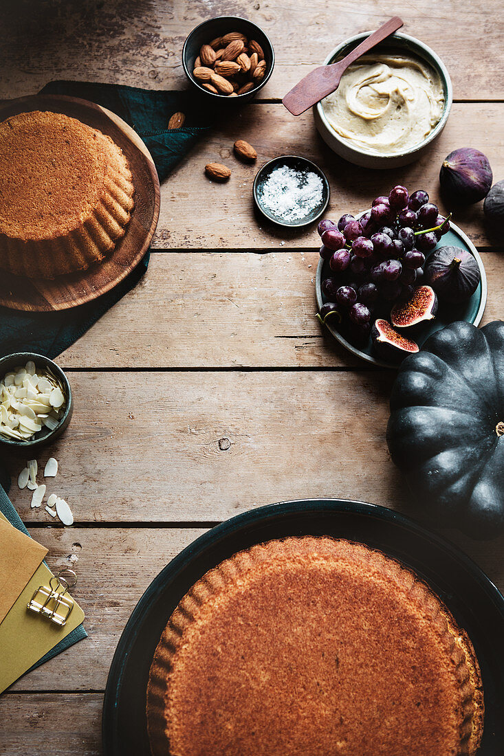 Ingredients for decorating vanilla cake with caramel frosting and fresh figs