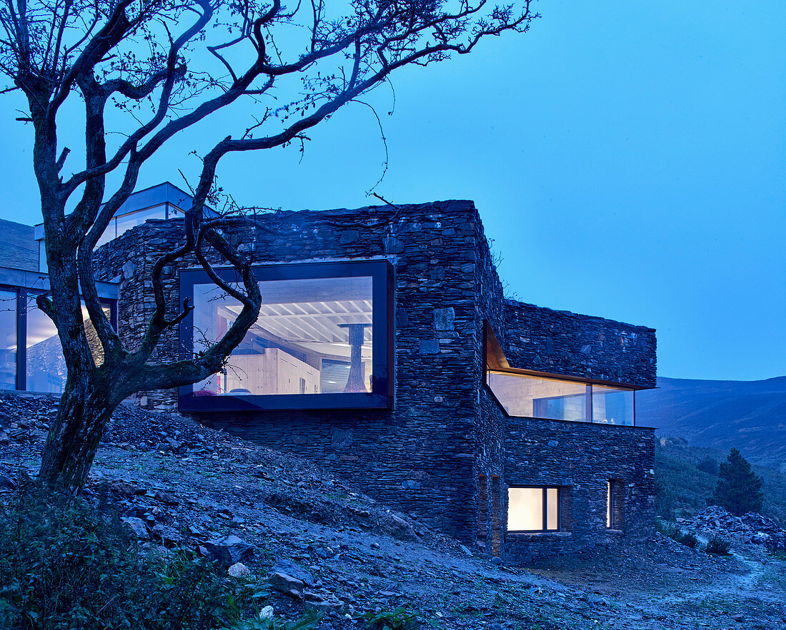 Modern architect-designed house integrated into landscape