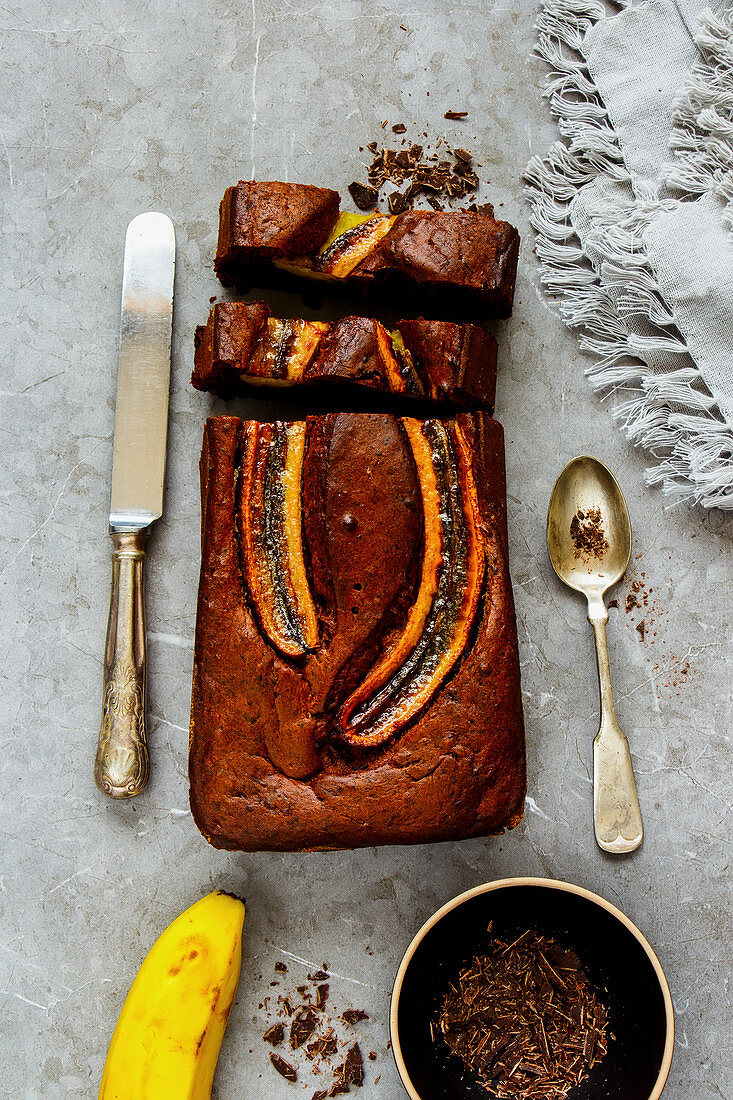 Freshly baked dark chocolate banana bread cake dessert and ingredients