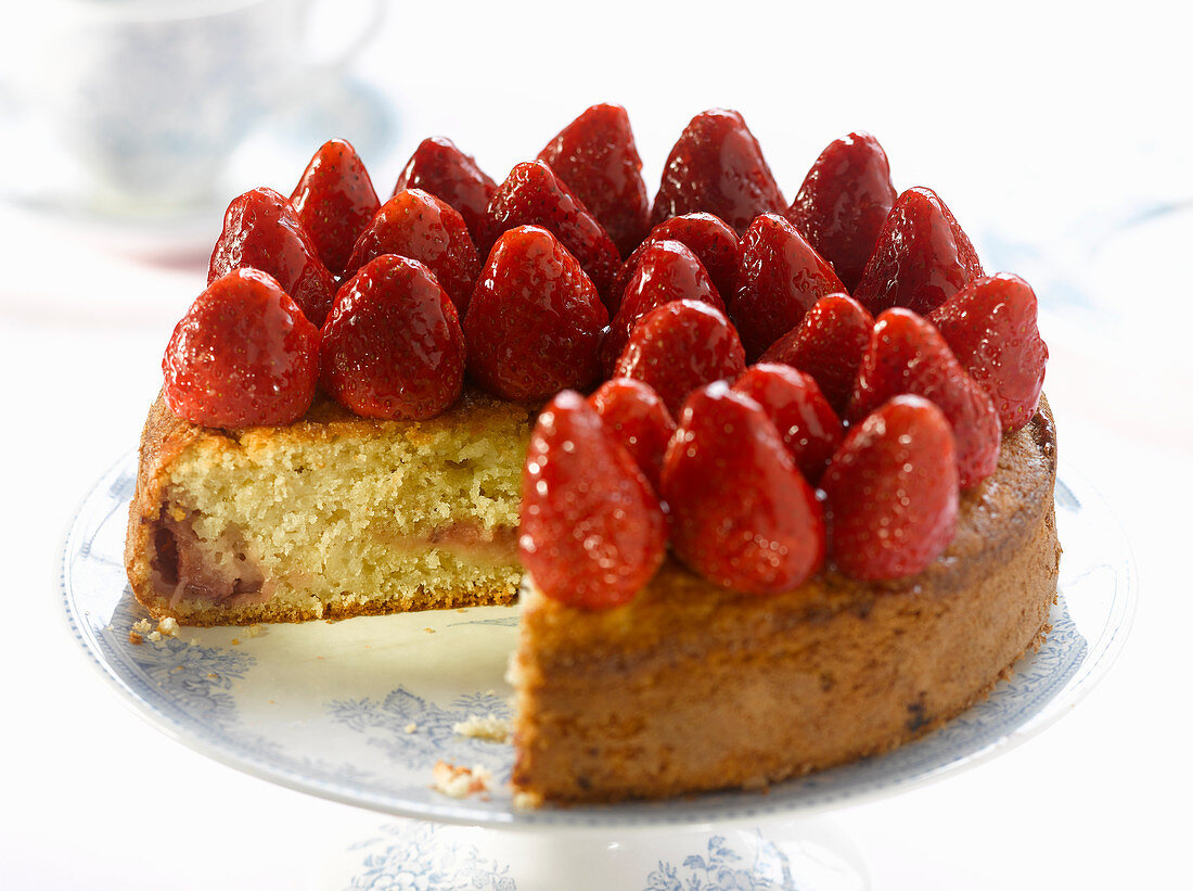 Sponge cake topped with whole strawberries