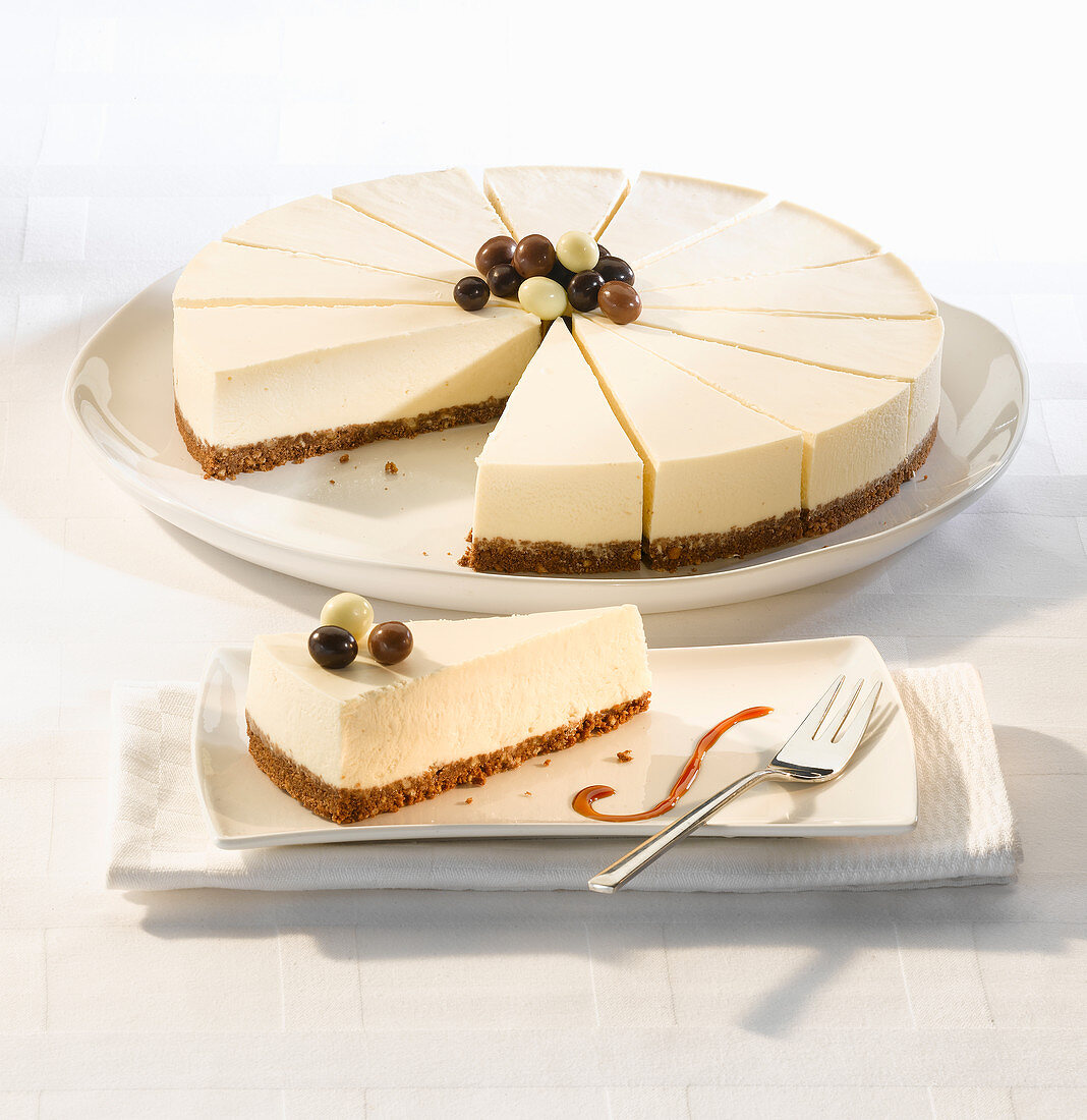 Vanilla cheesecake with a biscuit base serves fourteen