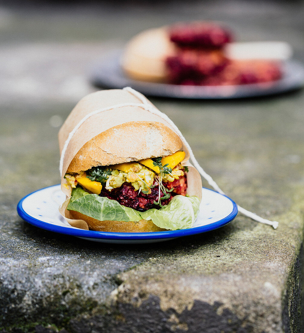 Burger with avocado, cress and beetroot