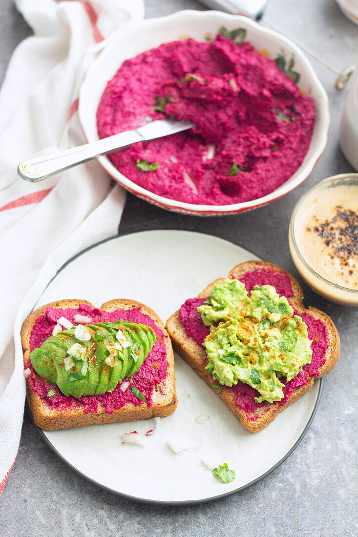 Beetroot hummus and avocado puree on toast