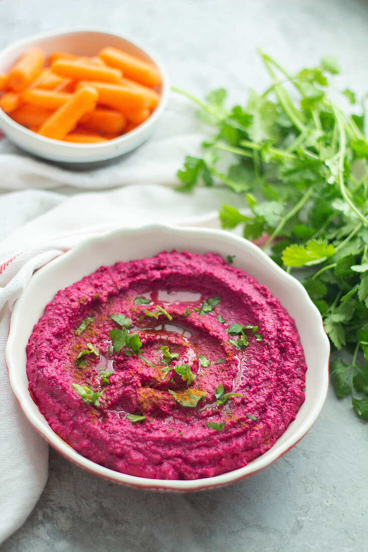 Beetroot hummus with coriander leaves