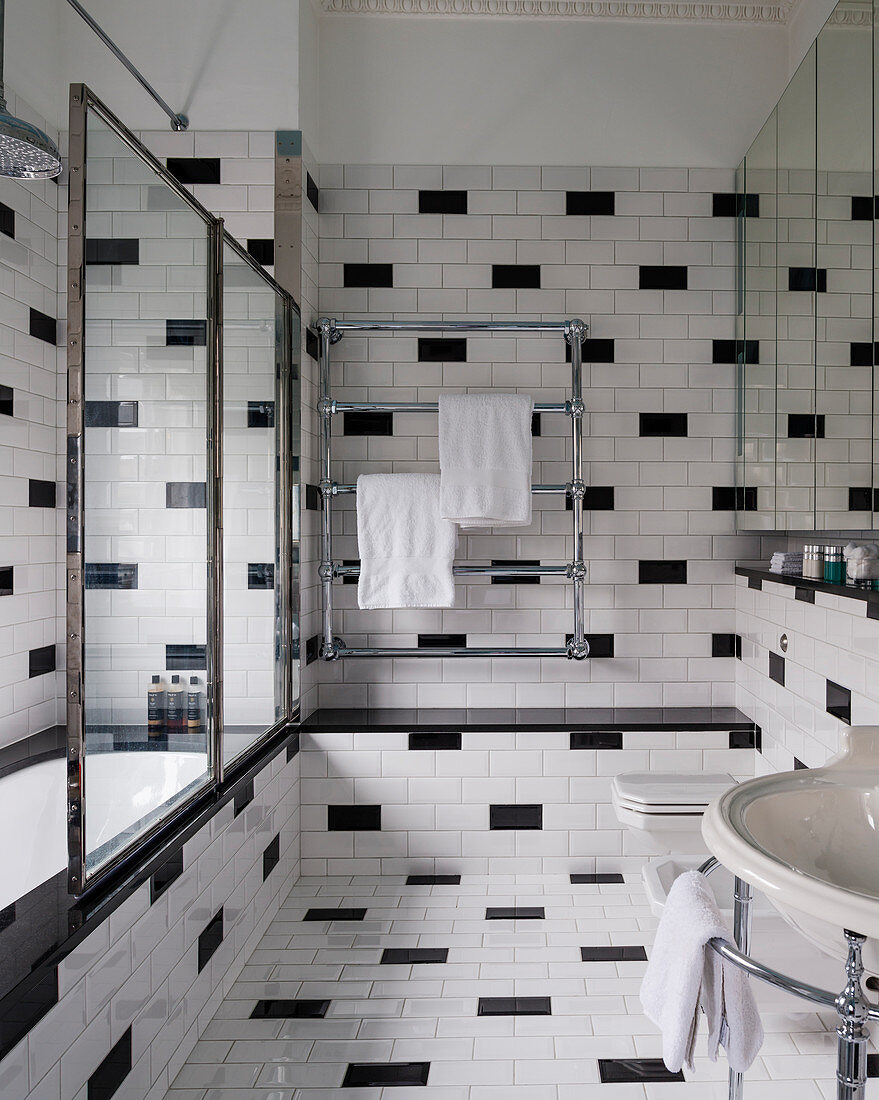 40s-style bathroom tiled in black and white